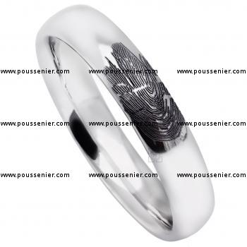 wedding band ring slightly rounded on the inner and outside (light oval profile) with a fingerprint on the outside