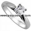 solitaire ring with a cushion cut diamond set in 4-prong setting between a band or shank and palmets on the side