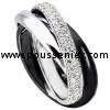 pavé ring three rounded crossed bands of which one half set with brilliant cut diamonds and one black rhodinated