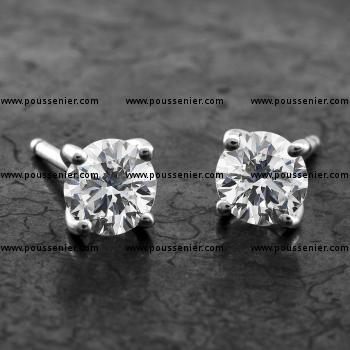 solitaire earrings with brilliant cut diamonds set in 4 rounded curved prongs