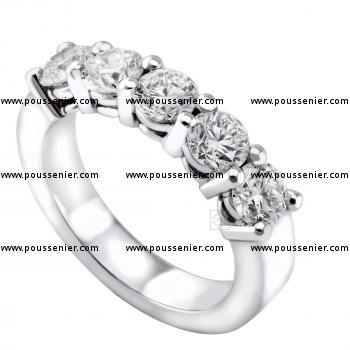anniversary ring with five larger brilliant cut diamonds set with two prongs on double roundels