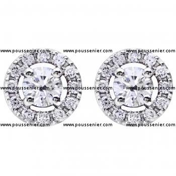 entourageearrings with a central brilliant cut diamond surrounded with smaller brilliant cut diamonds
