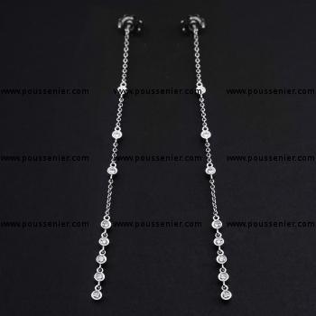 long earrings with brilliant cut bezel set diamonds connected with a rolo chain
