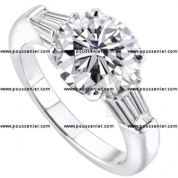 solitaire ring with a central brilliant cut diamond with 2 tapered baguettes on the side