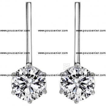 solitaire earrings with brilliant cut diamonds set with six prongs and pending on a tin bar