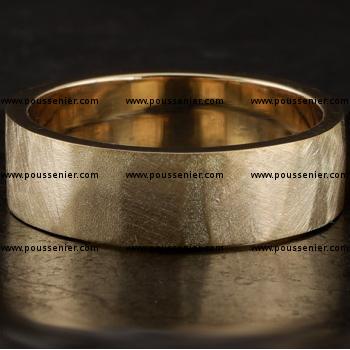 handmade wider wedding band with a rectangular profile with large hammered or filed rough surfaces 