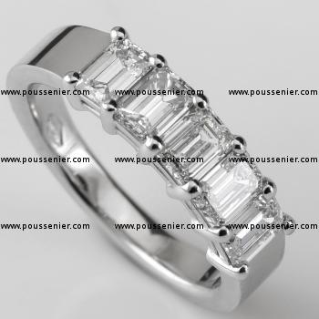 eternity ring with emerald cut diamonds set with two round prongs between each two diamonds