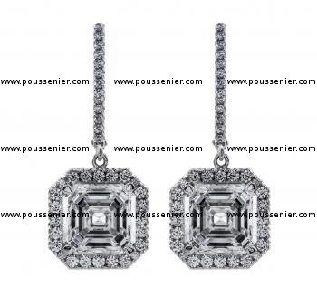 halo earrings with two central assher cut diamonds surrounded with smaller brilliant cut diamonds pending on a clip system