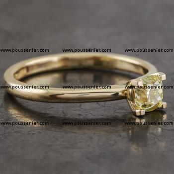 handmade solitaire ring with a fancy intense yellow cushion modified cut diamond set with 4 prongs in a convex setting made with square wire