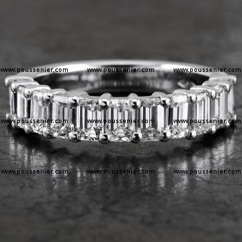 alliance ring with emerald cut diamonds set with two prongs between each two diamonds