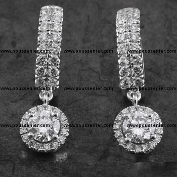 entourage or halo set earrings with two larger brilliant cut diamonds surrounded with smaller brilliant cut diamonds hanging loose with eyelet on oval castle set creole earrings OG0255/35/140+