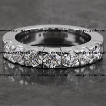 wedding ring with seven brilliant cut diamonds set in square block chatons