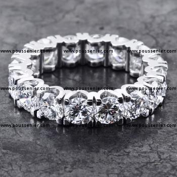full eternity ring with round brilliant cut diamonds set in four V-shaped prongs